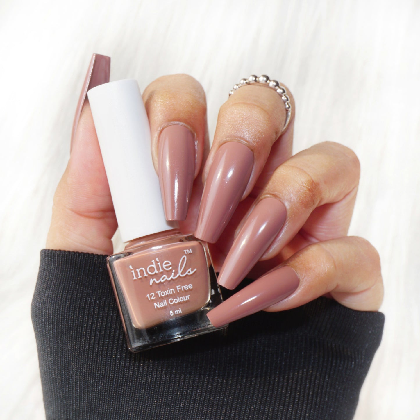 Bottle shot of Cutting Chai by Indie Nails on wooden chai tray