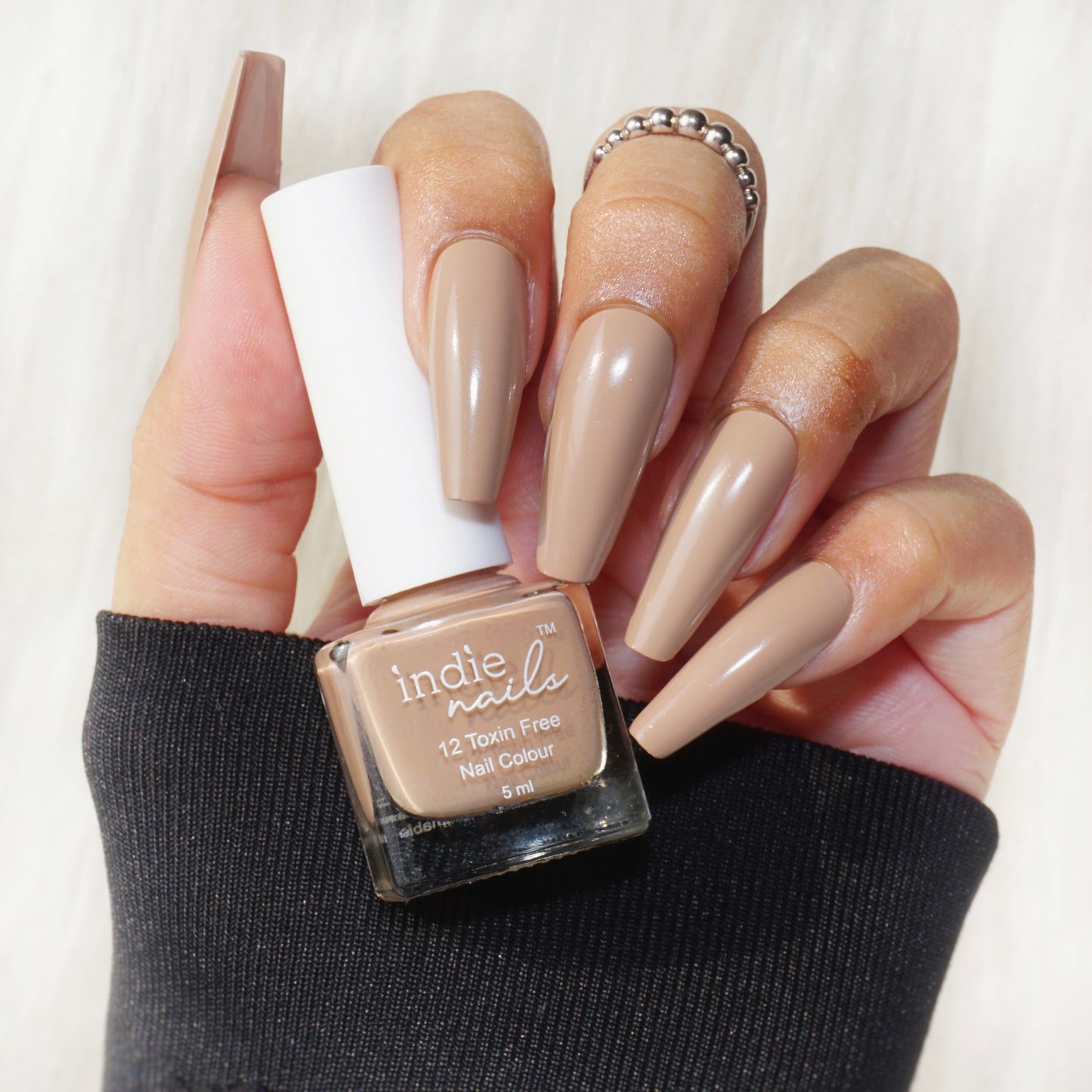 Mocha brown nail polish swatch on dusky Indian skin tone, Coffee-themed flat lay with Indie Nails Mocha bottle, Mocha shade on model holding a coffee cup, Close-up of glossy deep brown nails (Mocha)