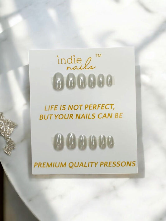 Pearly Grey soft gel press-on nails kit with glue and accessories, Pearly Grey nail set flatlay with complete kit