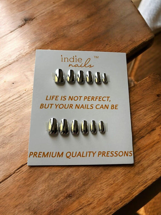 Close-up of silver chrome finish nails on hand, Reusable mirror effect press-on nails by Indie Nails