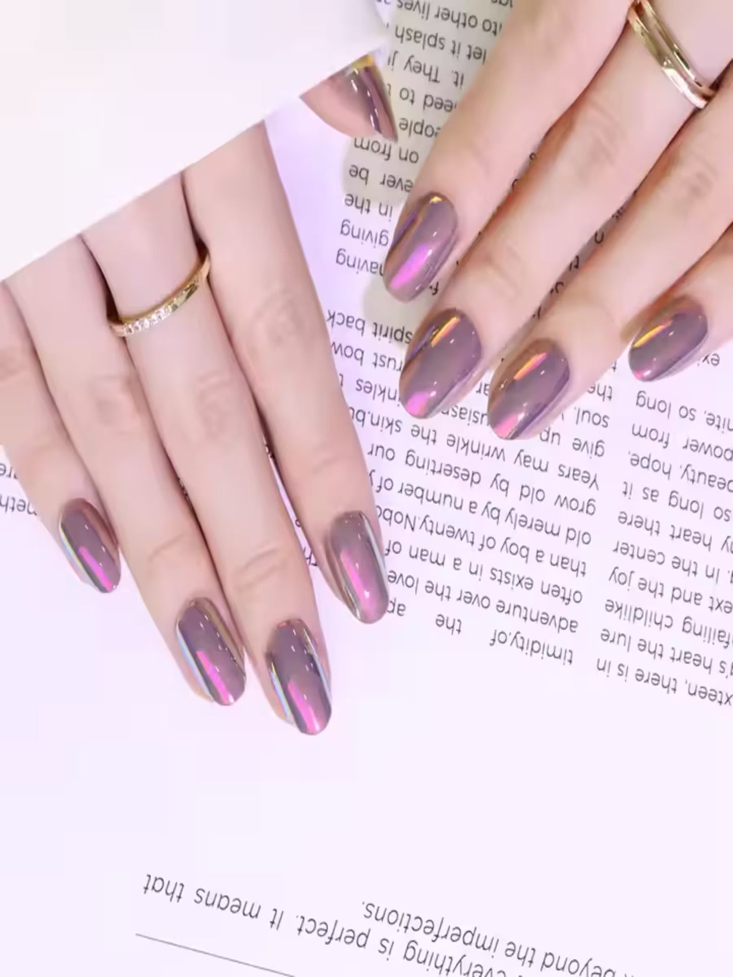 Model hand wearing Nosy Nude soft gel nails, Reusable nude nails with natural shine