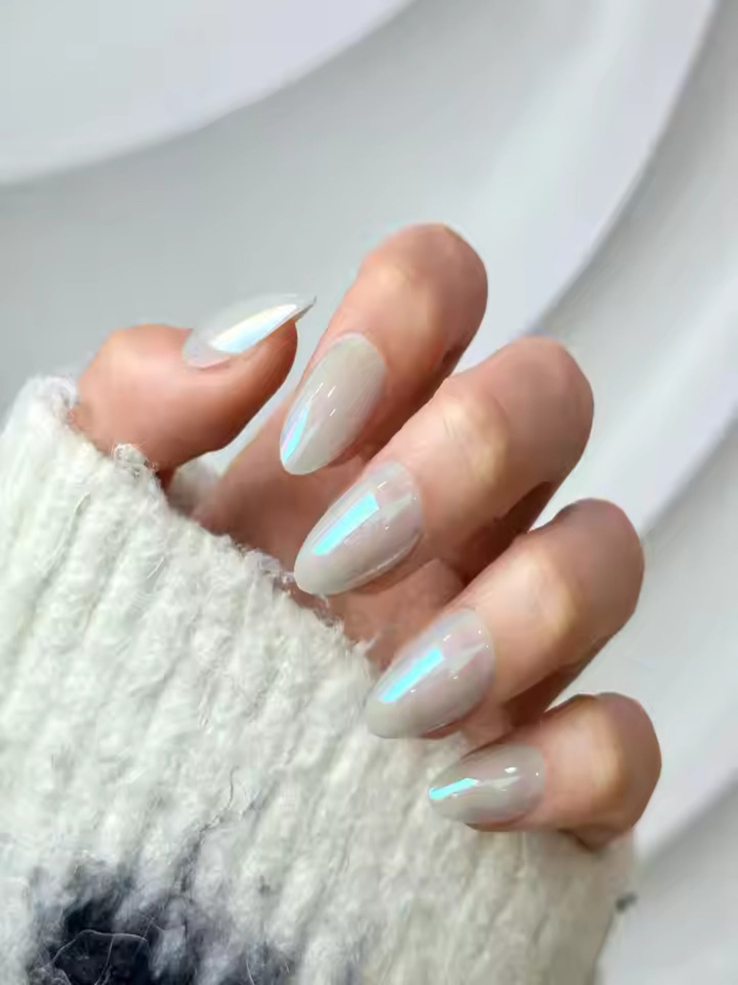 Glossy grey press-on nails for minimal nail look, Model wearing Pearly Grey nails from Indie Nails