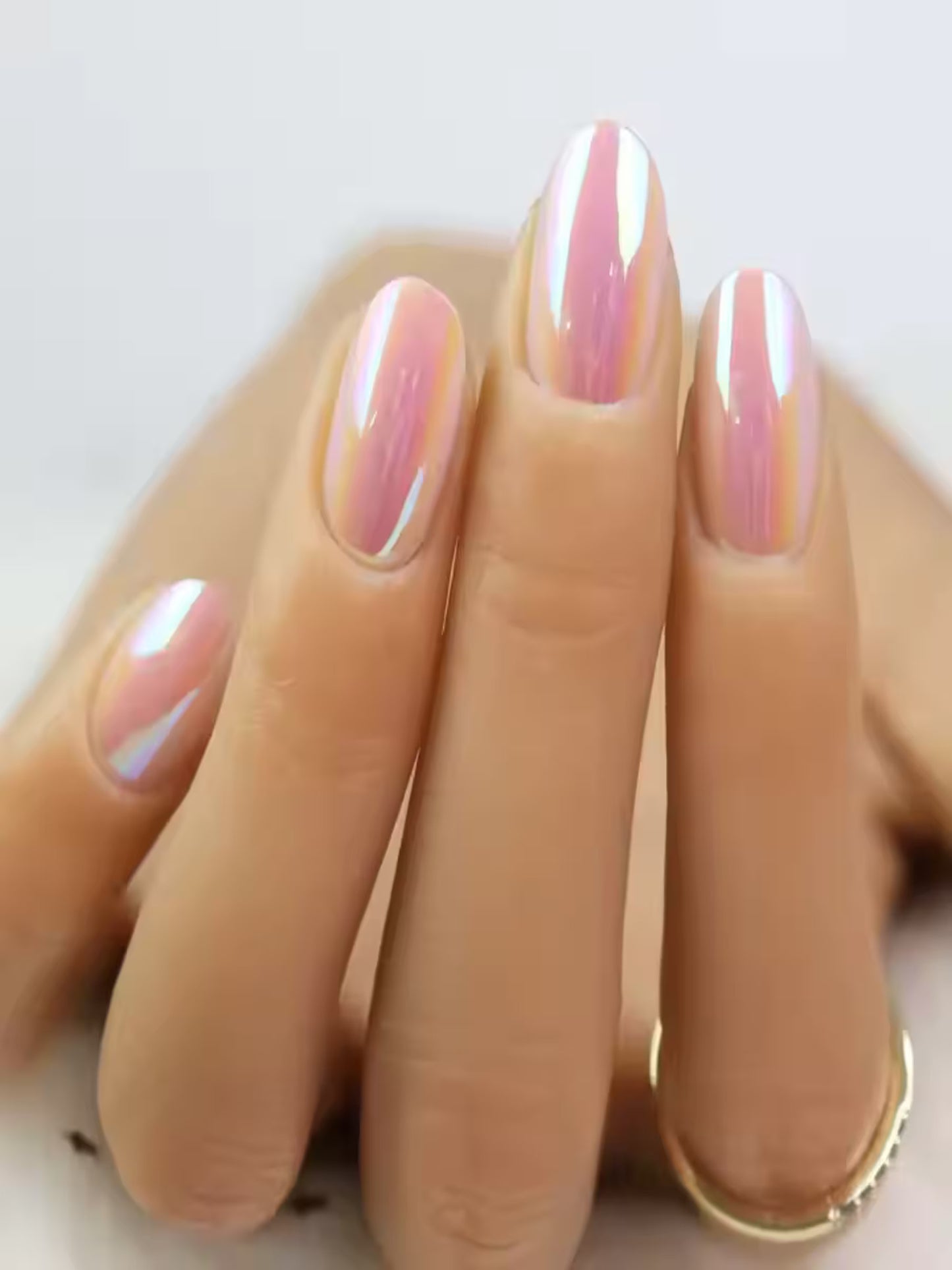 Reusable soft gel pink nails in bright lighting