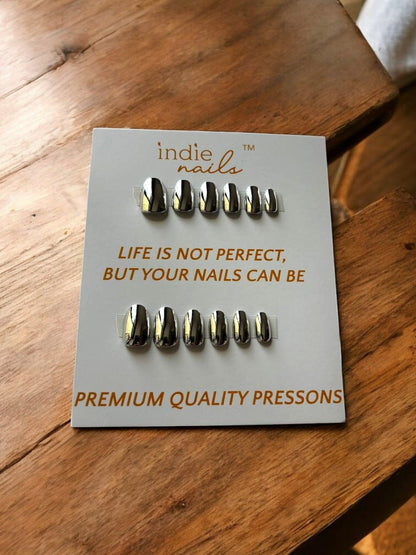 Close-up of silver chrome finish nails on hand, Reusable mirror effect press-on nails by Indie Nails
