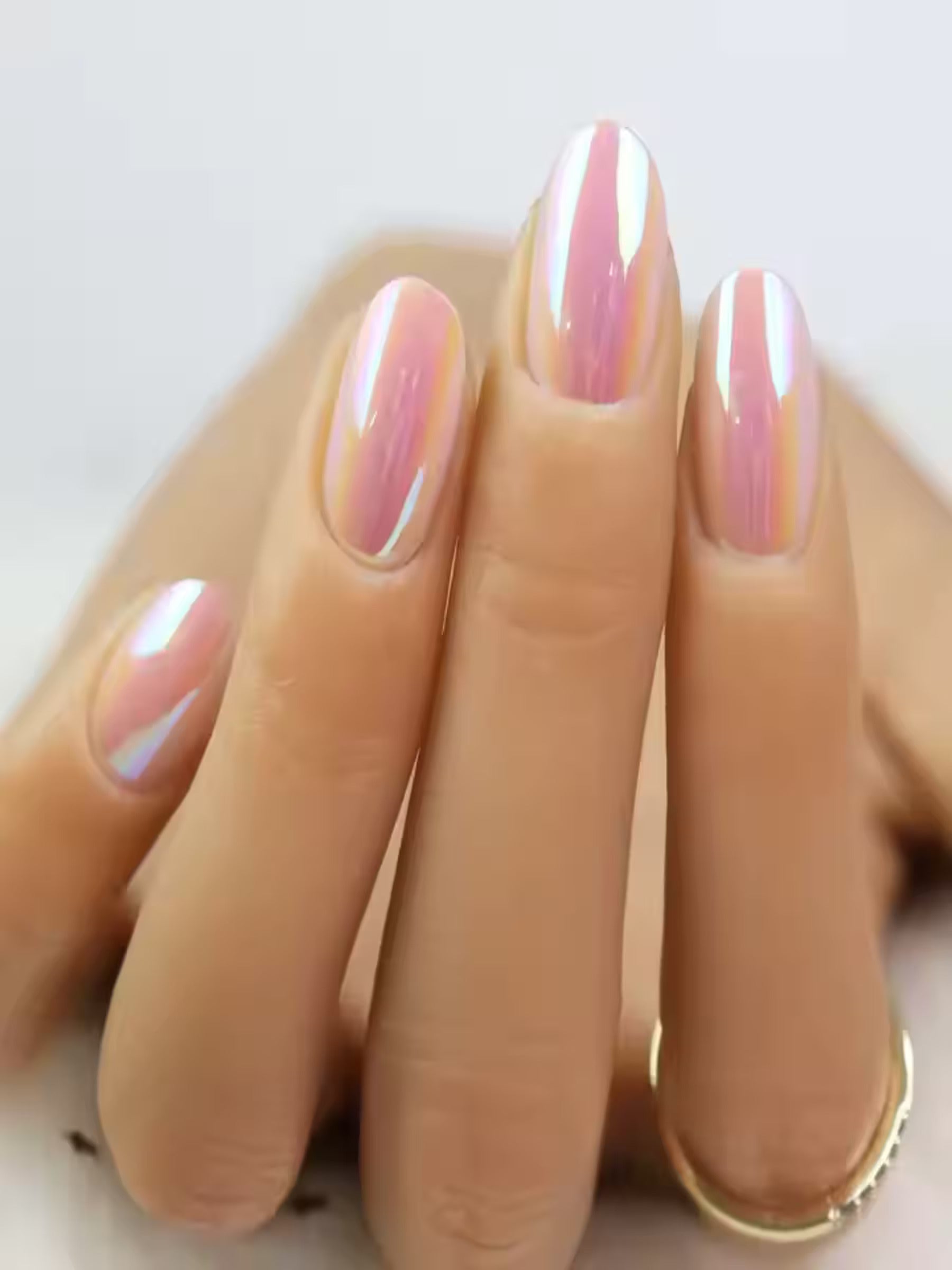 Reusable soft gel pink nails in bright lighting